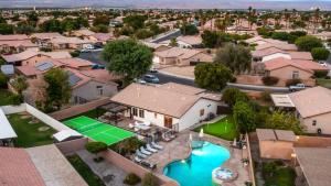 an aerial view of a house with a tennis court at Desert Escape - Private Pool - Spa in Indio