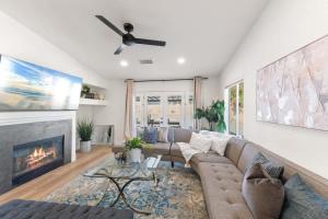 a living room with a couch and a fireplace at Desert Escape - Private Pool - Spa in Indio +38 photos