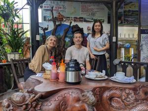a group of people sitting at a table at Terra Cotta Homestay in Hoi An