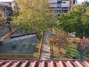 an overhead view of a park with trees and a building at Chaido's attic in Larisa