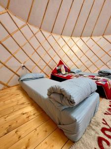 a room with two beds in a yurt at Отель 3 in Kurmenty +22 photos