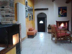a living room with a fireplace and a fire place at Casa Vacanza La Valle in Urbino