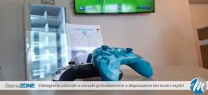a video game controller sitting on top of a table at Hotel Residence Mara in Lido di Jesolo