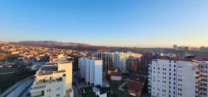 an aerial view of a city with tall buildings at Prishtina Apartment in Prishtinë