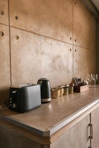 a counter with a toaster and other appliances on it at Gallo Vista B & B in Gillitts-Emberton +30 photos