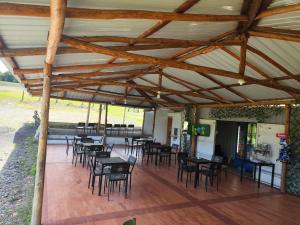 a group of tables and chairs in a pavilion at Cabañas Buenos aires in Guadalupe +17 photos