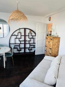 a living room with a couch and a table at Le Gouvernail in Le Tréport