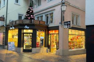 a store with a christmas tree on top of it at SleepandGo in Zurich