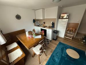 an overhead view of a kitchen with a table and a kitchen gmaxwell gmaxwell at Maison atypique Alsacienne in Kintzheim +4 photos