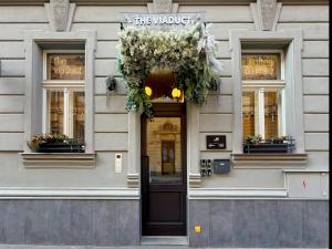 a building with a door with a wreath on it at The Viaduct - Suites & More in Prague