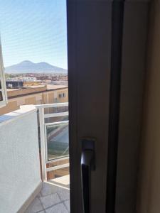 an open door to a balcony with a view at La casa di Ely in Sarno