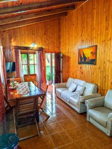 a living room with a couch and a table at Riberas del Parana in Wanda