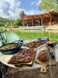 a table with many different types of food on it at L'Etang Des Cigales in Uchaux