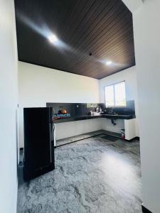 a room with a kitchen with a counter top at Apollo Villa Weligama in Weligama