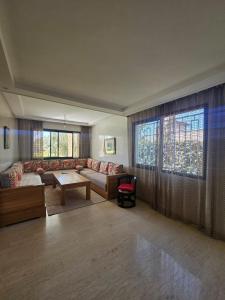 a living room with a couch and a table at Villa in Aït Bou Zguia