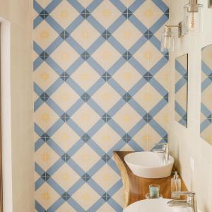 a bathroom with a blue and yellow tiled wall at DezMont Guest House in Mérida +13 photos