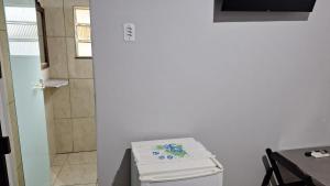 a room with a table and a refrigerator and a door at Vera's Apart-Hotel & Restaurante in Belém +77 photos