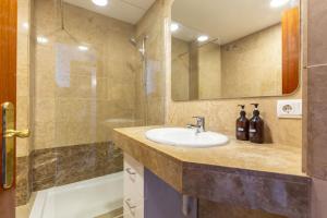 a bathroom with a sink and a shower at Picasso Suites in Barcelona +156 photos