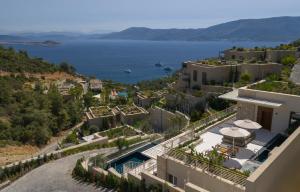 arial view of a house with a view of the water at WAM by Karma in Bodrum City +73 photos