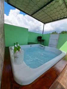 a bath tub with two bottles of beer in it at Hermoso Loft in Santo Domingo