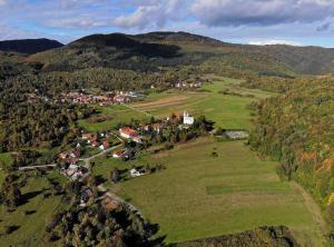 an aerial view of a village in the hills at Sošice Garden Apartments in Sošice