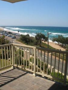 a balcony with a view of the beach at Umdloti Cabanas 32 Triplex in Umdloti