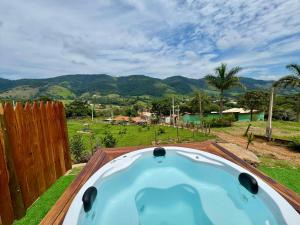 a jacuzzi tub on the roof of a house at Chalés São Pedro in Socorro