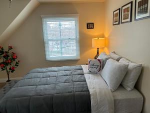 a bedroom with a large bed and a window at Sexy Suite in Cedarburg