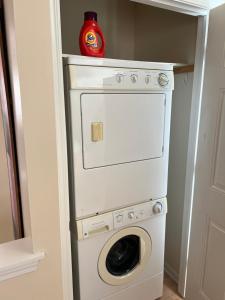 a white washer and dryer in a closet at Sexy Suite in Cedarburg +2 photos
