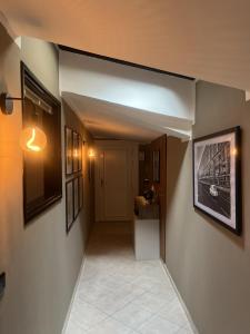 an empty hallway with a hallway at Eporedia Inn in Ivrea