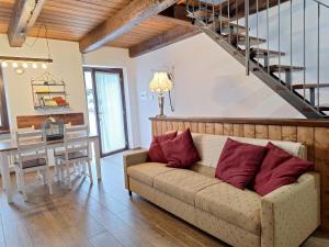 a living room with a couch and a table at Locanda del Sasso Rooms in Crodo