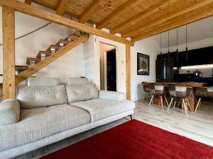 a living room with a couch and a red rug at Villa Goga in Ruta +28 photos