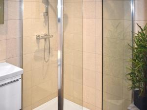 a shower with a glass door in a bathroom at Lodge 1 - Uk51077 in Lyme Regis
