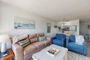 a living room with a couch and two chairs at ABPAB166 Sandy Shores in Atlantic Beach