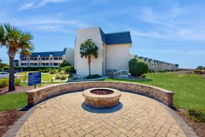 a brick circle in front of a building at ABPAB166 Sandy Shores in Atlantic Beach