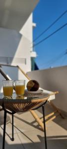 a table with two cups on top of it at Xenia Residence in Faliraki