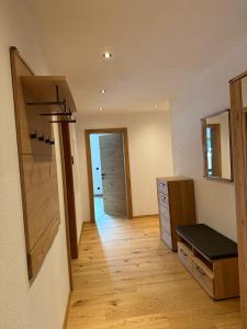 a room with a hallway with a wooden floor at Apartment Kirchfeld in Aurach bei Kitzbuhel