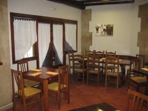
a dining room filled with tables and chairs at Gurutzeberri in Oiartzun
