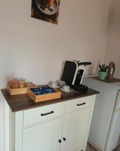 a kitchen counter with bread and a toaster on it at IL MELOGRANO Rooms in Vignacastrisi +19 photos