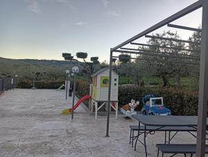 a playground with a slide and a playset at B&B Pozzo Innamorato in Montenero di Bisaccia