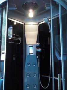 a bathroom with a walk in shower in a bus at Landhuis "Op de Heugte" in Norg