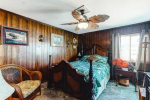 a bedroom with a bed and a ceiling fan at ABSS102 Seaspray 224 in Atlantic Beach