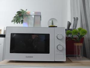 a microwave oven sitting on top of a table at Urban in Suwon +21 photos