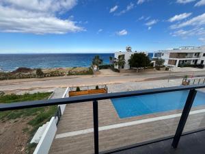 a balcony with a view of the ocean at Caesar Cliff Onyx 12 in Ayios Khariton