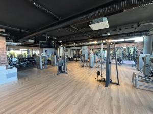a gym with lots of treadmills and machines at Caesar Cliff Onyx 12 in Ayios Khariton
