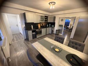 an aerial view of a kitchen and living room with a table at Sweet Sleep Apartment in Burg Stargard +81 photos