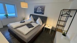 a bedroom with a bed with a ladder in it at Sweet Sleep Apartment in Burg Stargard