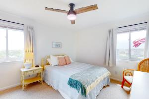 a bedroom with a bed and a ceiling fan at ABSW163 Southwinds H13 in Atlantic Beach +42 photos