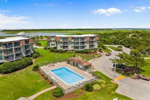 an aerial view of an apartment complex with a swimming pool at ABSW163 Southwinds H13 in Atlantic Beach