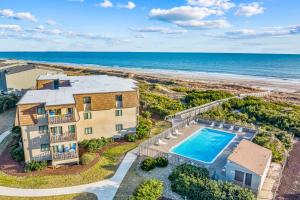 an aerial view of a house with a swimming pool and the beach at ABSW163 Southwinds H13 in Atlantic Beach
